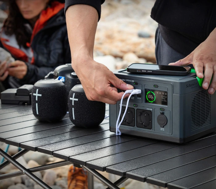 Schneider OffGrid 330 portable power station charging devices while camping